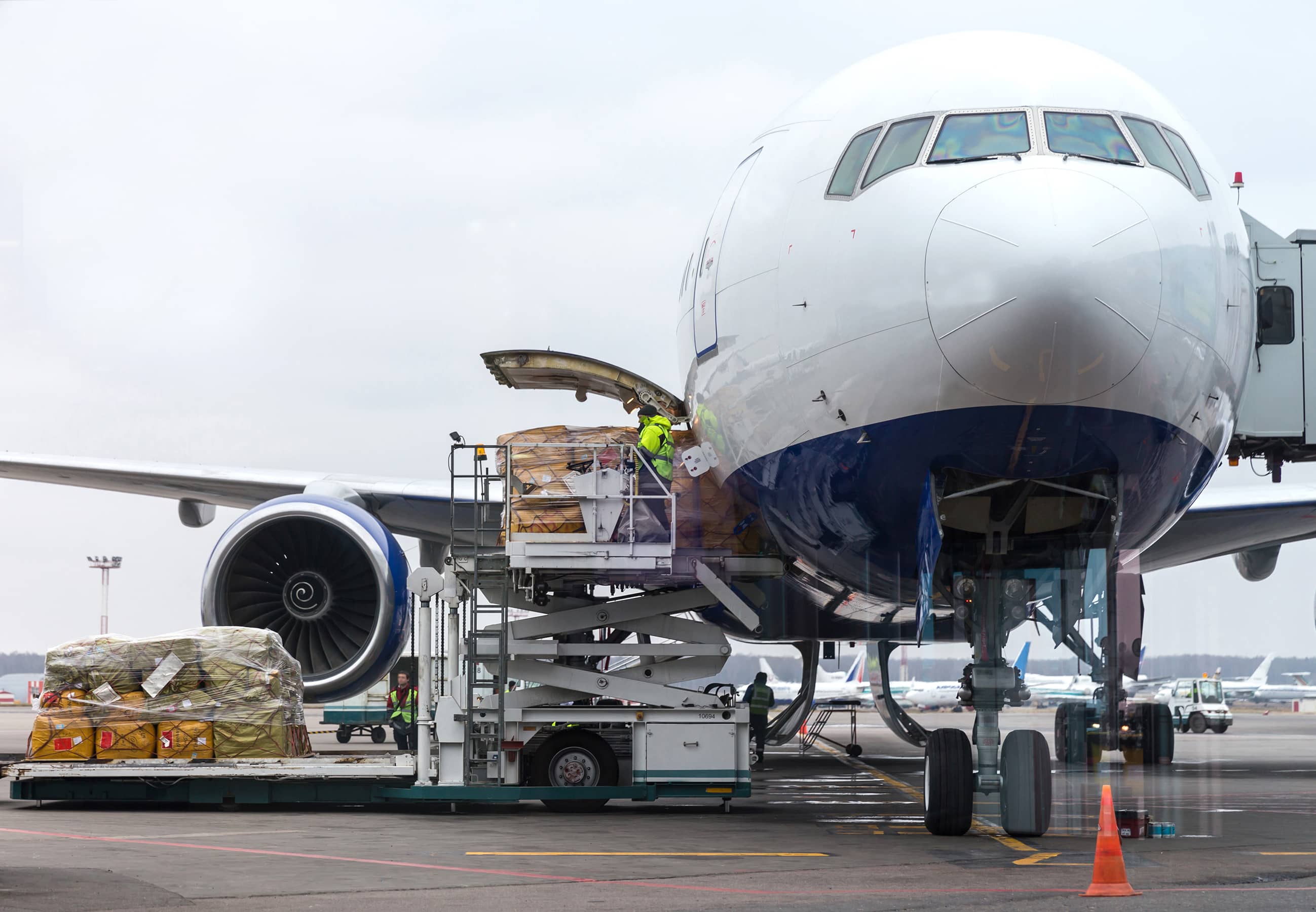 stock-photo-loading-cargo-into-the-aircraft-before-departure-299178752